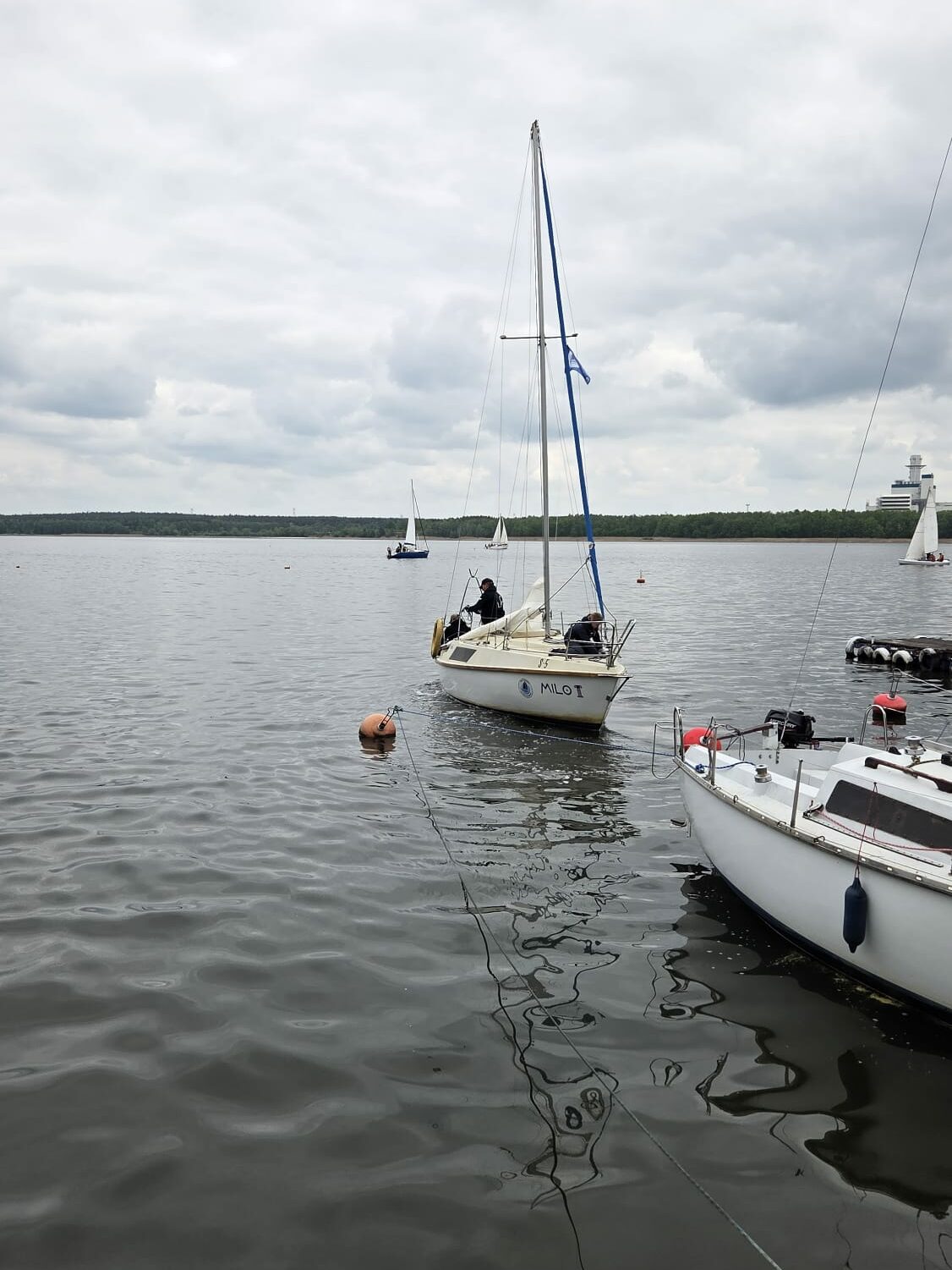 Scenic view of a sailboat cruising through the serene waters of Finland's archipelago region.